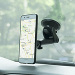 360° universal magnetic phone holder with suction cup mounted on car dashboard displaying smartphone