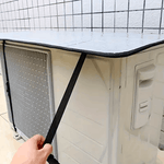 Reflective aluminum outdoor AC unit cover protecting air conditioner from sun, rain, and dust