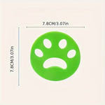 Reusable pet hair remover in paw print design for laundry washing machine use