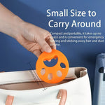 Reusable pet hair remover with paw print design for washing machine use